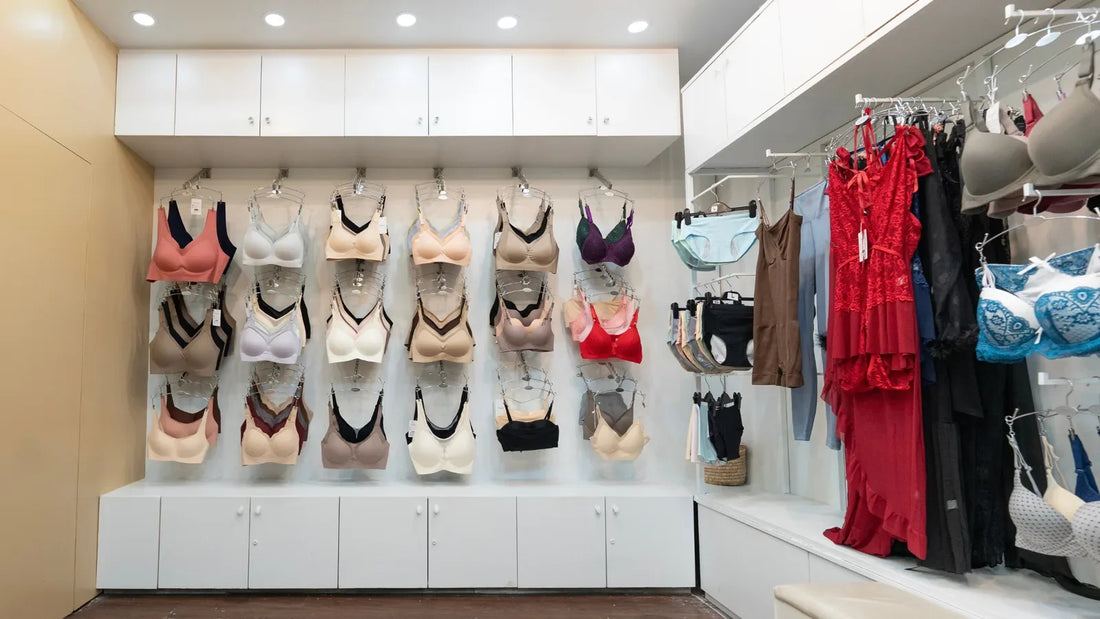 Bra display wall at SHAPE Lingerie Gulshan showing seamless and sports bra styles in rows