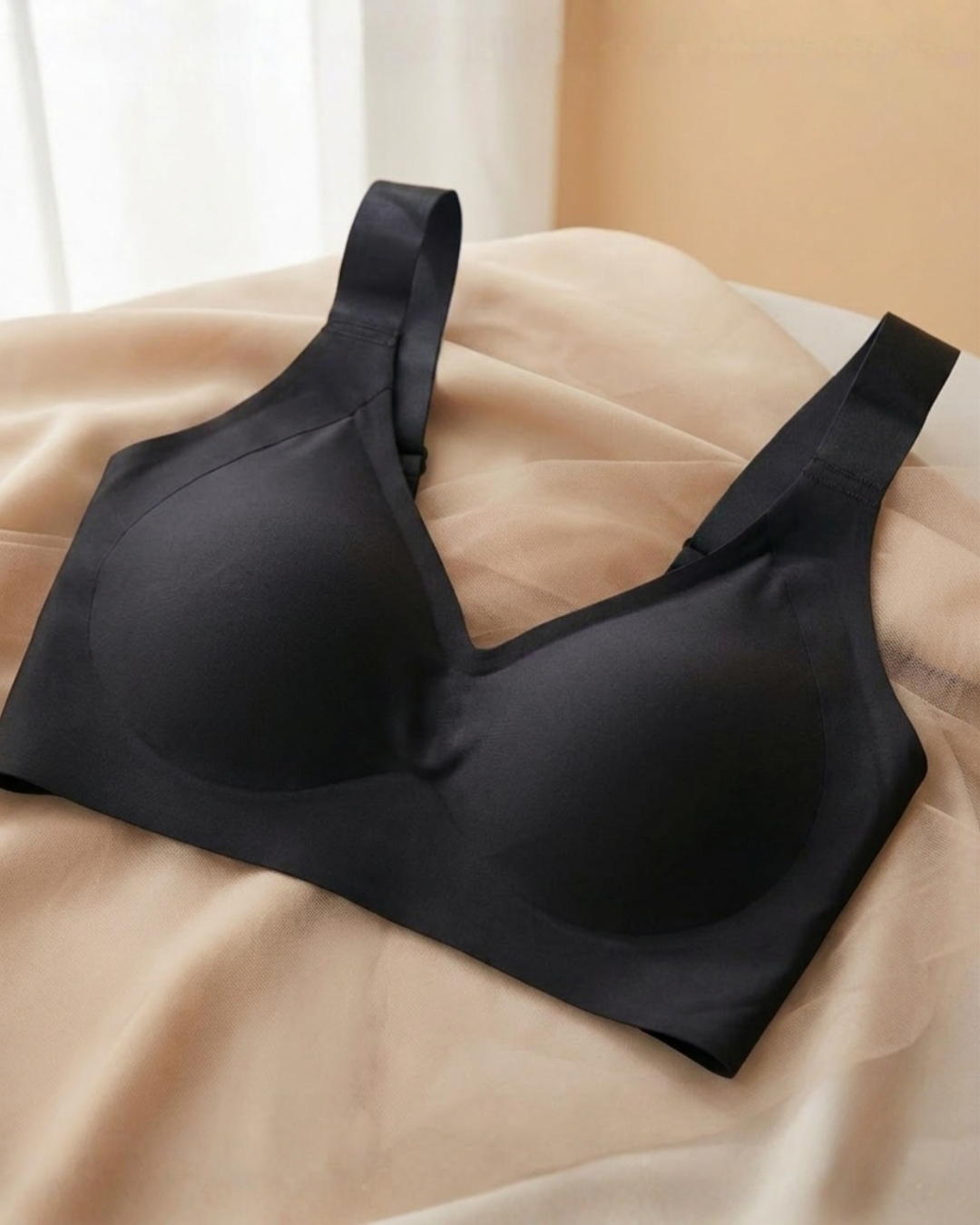 Model wearing SHAPE Plus Size Sculpting Bra in Black, side view