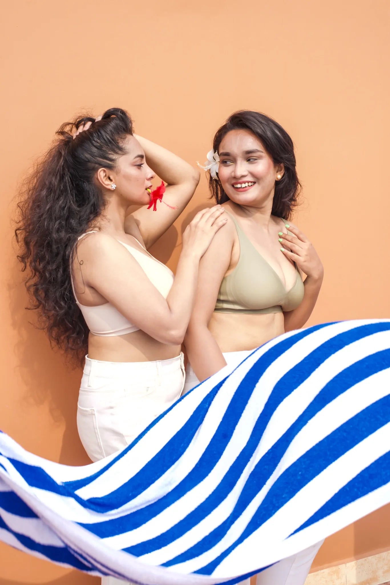 Two models wearing cream and sage SHAPE Plunge Lite bras