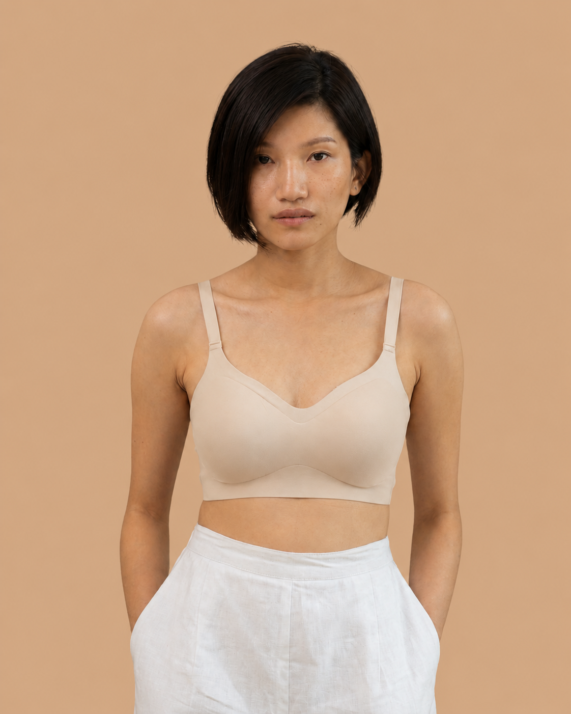 Signature Seamless Bra beige worn by a model, SHAPE